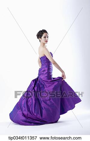 a lady in fancy purple dress posing View Large Photo Image Stock Photo - a lady in fancy purple dress posing. Fotosearch