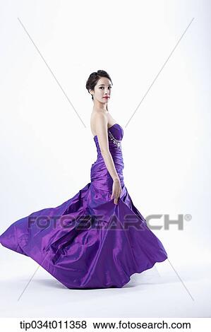 a lady in fancy purple dress posing View Large Photo Image Stock Photo - a lady in fancy purple dress posing. Fotosearch