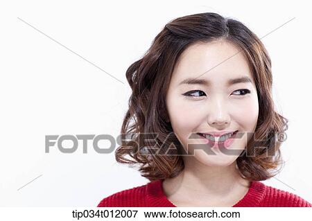 Stock Photo - a lady in red sweater smiling . Fotosearch
