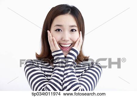 Picture - a lady in striped clothes looking happy. Fotosearch