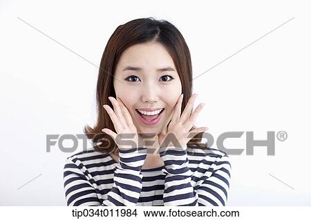 Picture - a lady in striped clothes looking happy. Fotosearch
