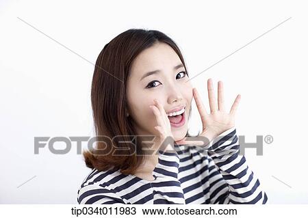Stock Image - a lady in striped clothes looking happy. Fotosearch