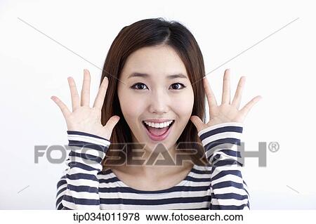Stock Photo - a lady in striped clothes looking happy. Fotosearch