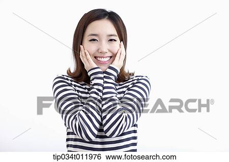 Stock Photograph - a lady in striped clothes looking happy. Fotosearch