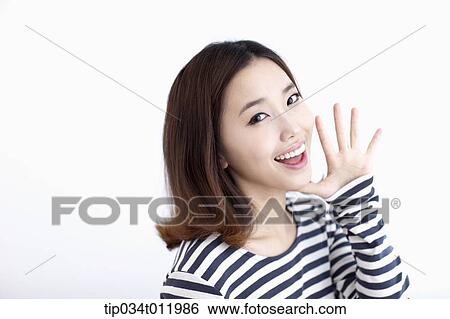 Stock Photograph - a lady in striped clothes looking happy. Fotosearch