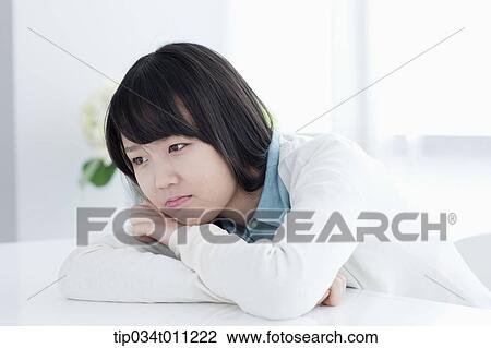 a lady leaning on a desk View Large Photo Image Stock Image - a lady leaning on a desk. Fotosearch