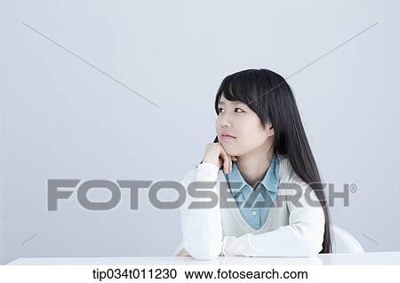 a lady leaning on a desk with arms View Large Photo Image Stock Image - a lady leaning on a desk with arms. Fotosearch