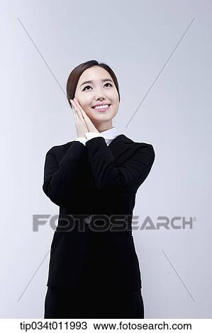 a lady smiling in business suit View Large Photo Image Stock Image - a lady smiling in business suit. Fotosearch