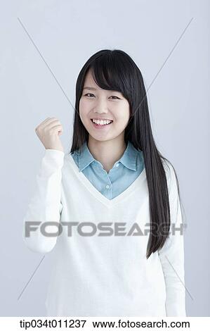 a lady with cheering pose View Large Photo Image Stock Photo - a lady with cheering pose. Fotosearch