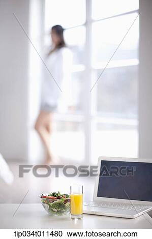 a laptop with juice and salad View Large Photo Image Stock Image - a laptop with juice and salad. Fotosearch