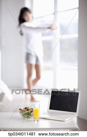a laptop with juice and salad View Large Photo Image Stock Image - a laptop with juice and salad. Fotosearch