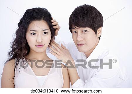 a male hairdresser taking care of woman's hair View Large Photo Image Stock Image - a male hairdresser taking care of woman's hair . Fotosearch