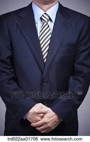 a man in business suit standing neatly View Large Photo Image Stock Photograph - a man in business suit standing neatly. Fotosearch