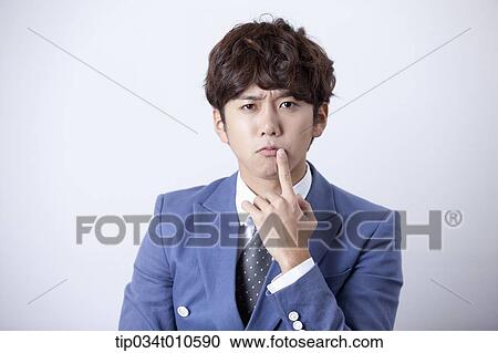 Stock Image - a man looking confused. Fotosearch