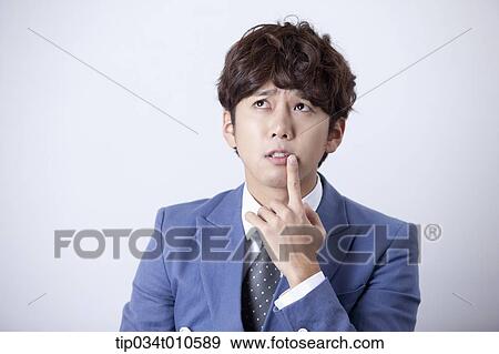Stock Photo - a man looking confused. Fotosearch