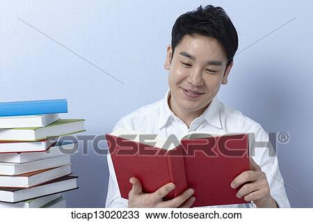 a man reading books View Large Photo Image Stock Image - a man reading books. Fotosearch