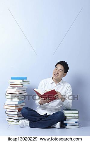 a man reading books View Large Photo Image Stock Photo - a man reading books. Fotosearch