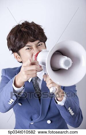a man shouting through a megaphone View Large Photo Image Stock Image - a man shouting through a megaphone. Fotosearch