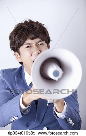 a man shouting through a megaphone View Large Photo Image Stock Photography - a man shouting through a megaphone. Fotosearch