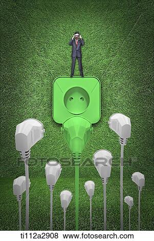 a man standing on a socket with plugs in front View Large Photo Image Stock Photo - a man standing on a socket with plugs in front. Fotosearch