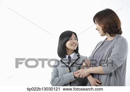 a mother and a daughter in school uniform View Large Photo Image Stock Image - a mother and a daughter in school uniform. Fotosearch