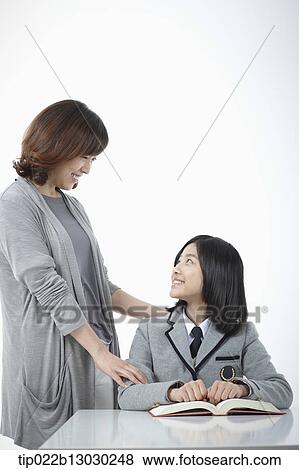 a mother with her daughter doing homework View Large Photo Image Stock Photo - a mother with her daughter doing homework. Fotosearch
