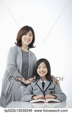 a mother with her daughter doing homework View Large Photo Image Stock Photograph - a mother with her daughter doing homework. Fotosearch