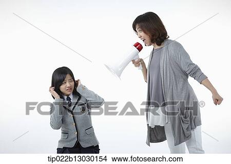 a mother yelling at daughter with a school uniform View Large Photo Image Picture - a mother yelling at daughter with a school uniform. Fotosearch