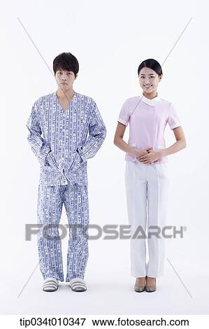 Stock Photo - a patient and a nurse standing together. Fotosearch