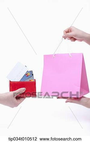 a person receiving pink shopping bag after paying View Large Photo Image Stock Image - a person receiving pink shopping bag after paying. Fotosearch