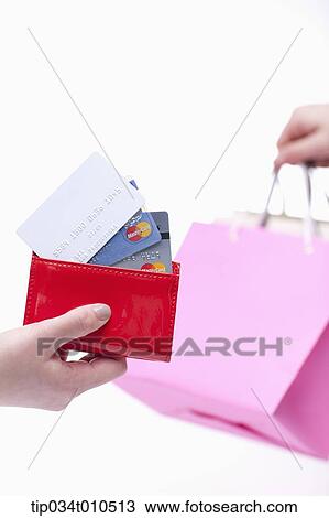 a person receiving pink shopping bag after paying View Large Photo Image Stock Image - a person receiving pink shopping bag after paying. Fotosearch