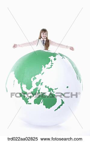 a student in uniform on top of a globe View Large Photo Image Stock Photography - a student in uniform on top of a globe. Fotosearch