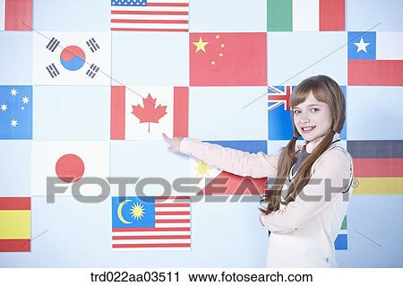 a student in uniform pointing one of international flags View Large Photo Image Stock Image - a student in uniform pointing one of international flags. Fotosearch