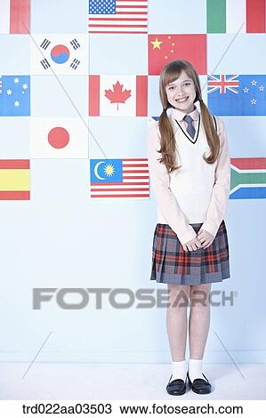 a student in uniform posing in front of international flags View Large Photo Image Stock Image - a student in uniform posing in front of international flags. Fotosearch