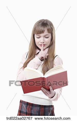 a student in uniform reading a book on white background View Large Photo Image Stock Photo - a student in uniform reading a book on white background. Fotosearch