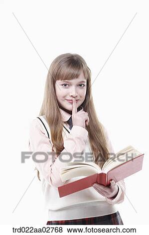 a student in uniform reading a book on white background View Large Photo Image Stock Photo - a student in uniform reading a book on white background. Fotosearch