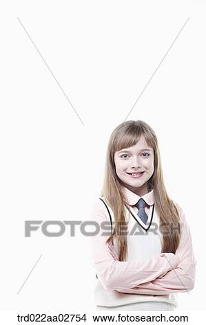 a student in uniform standing arms crossed on white background View Large Photo Image Picture - a student in uniform standing arms crossed on white background. Fotosearch