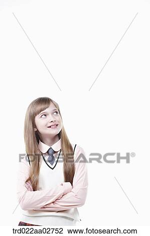 a student in uniform standing arms crossed on white background View Large Photo Image Stock Image - a student in uniform standing arms crossed on white background. Fotosearch