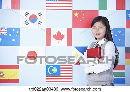 a student in uniform standing in front of international flags View Large Photo Image Stock Image - a student in uniform standing in front of international flags. Fotosearch