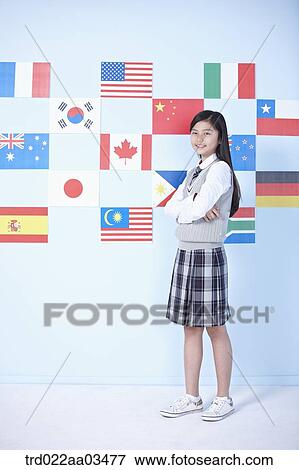 a student in uniform standing in front of international flags View Large Photo Image Stock Photo - a student in uniform standing in front of international flags. Fotosearch