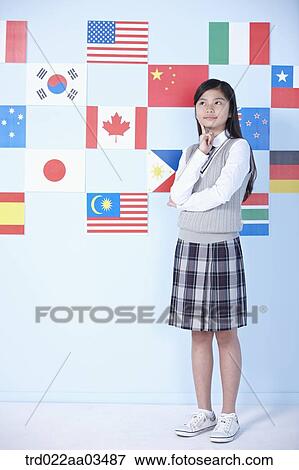 a student in uniform standing in front of international flags View Large Photo Image Stock Photo - a student in uniform standing in front of international flags. Fotosearch