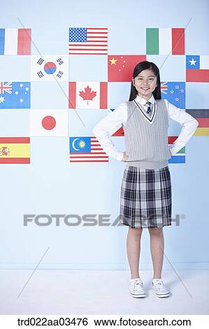 a student in uniform standing in front of international flags View Large Photo Image Stock Photograph - a student in uniform standing in front of international flags. Fotosearch