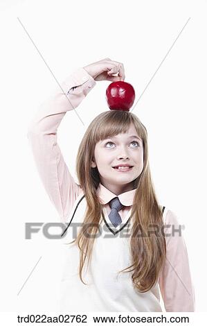 a student in uniform with an apple on white background View Large Photo Image Stock Image - a student in uniform with an apple on white background. Fotosearch