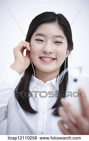 a student listening to music View Large Photo Image Stock Photo - a student listening to music. Fotosearch