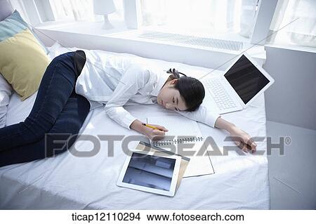 a student studying on bed View Large Photo Image Picture - a student studying on bed. Fotosearch