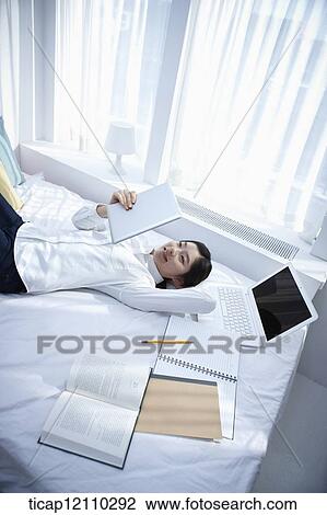 a student studying on bed View Large Photo Image Stock Image - a student studying on bed. Fotosearch