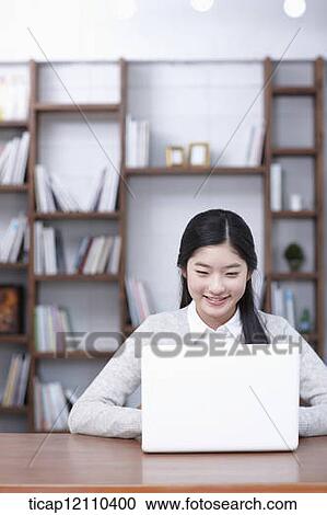 a student using laptop in study room View Large Photo Image Stock Image - a student using laptop in study room. Fotosearch