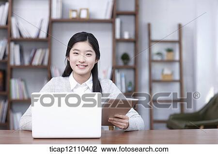 a student using laptop in study room View Large Photo Image Stock Image - a student using laptop in study room. Fotosearch