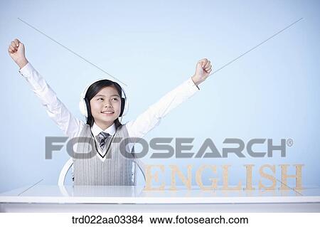 a student with a block of words saying English View Large Photo Image Picture - a student with a block of words saying English. Fotosearch