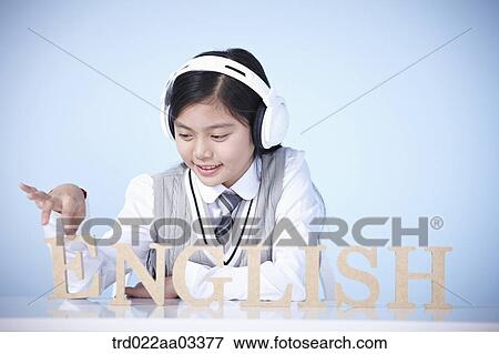 a student with a block of words saying English View Large Photo Image Stock Photo - a student with a block of words saying English. Fotosearch
